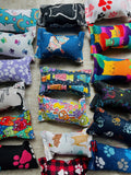 Colorful catnip toys with various designs on a neutral background