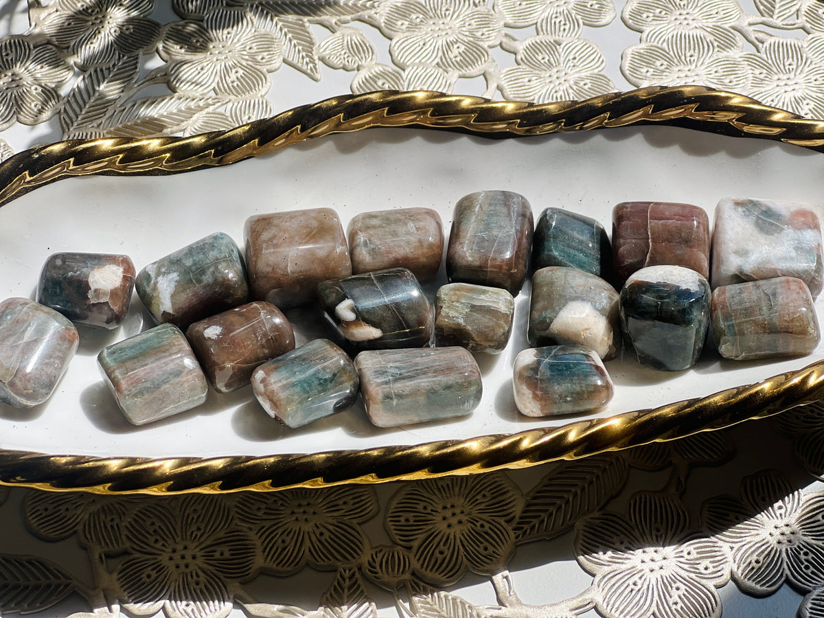 Decorative tray with decorative stones on a patterned surface