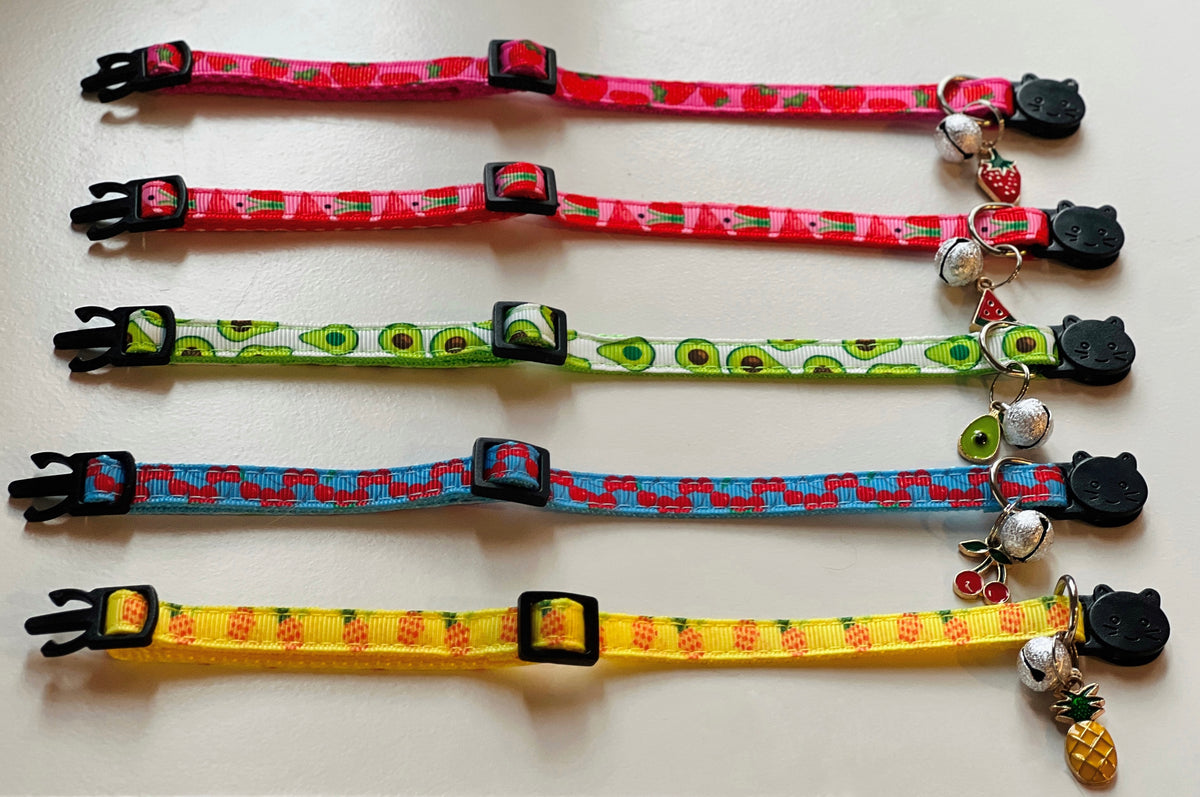 Set of colorful cat collars with various patterns on a white background