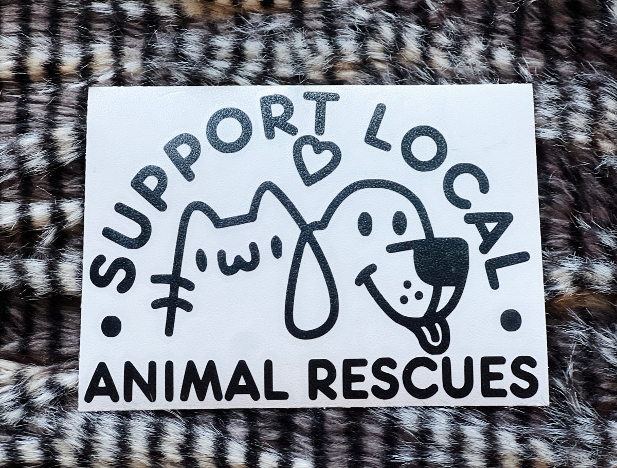 Sticker with text 'Support Local Animal Rescues' featuring a cat and dog illustration on a fur background.